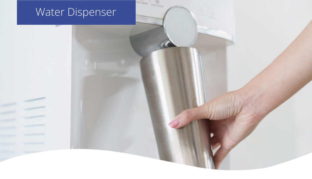 A woman filling up her water bottle at a water dispenser